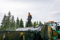 Worker on the tank with bitumen in the repair of highways, July